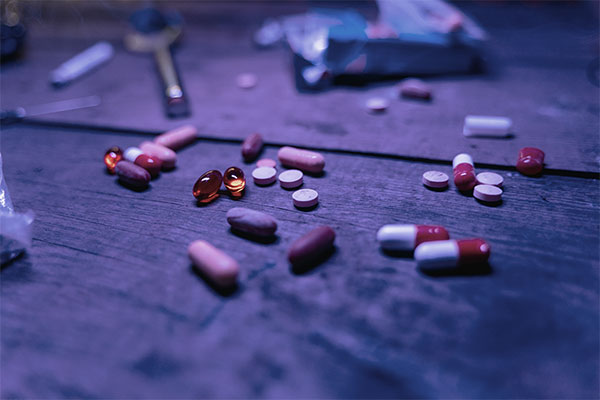 drugs and medicines on wooden surface