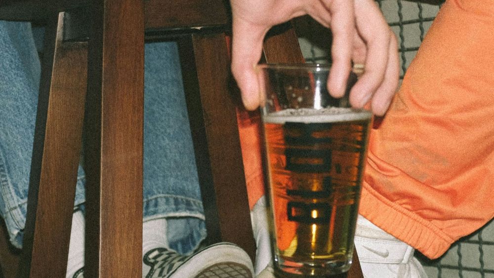 person holding a glass of alcohol (Prozac and Alcohol)