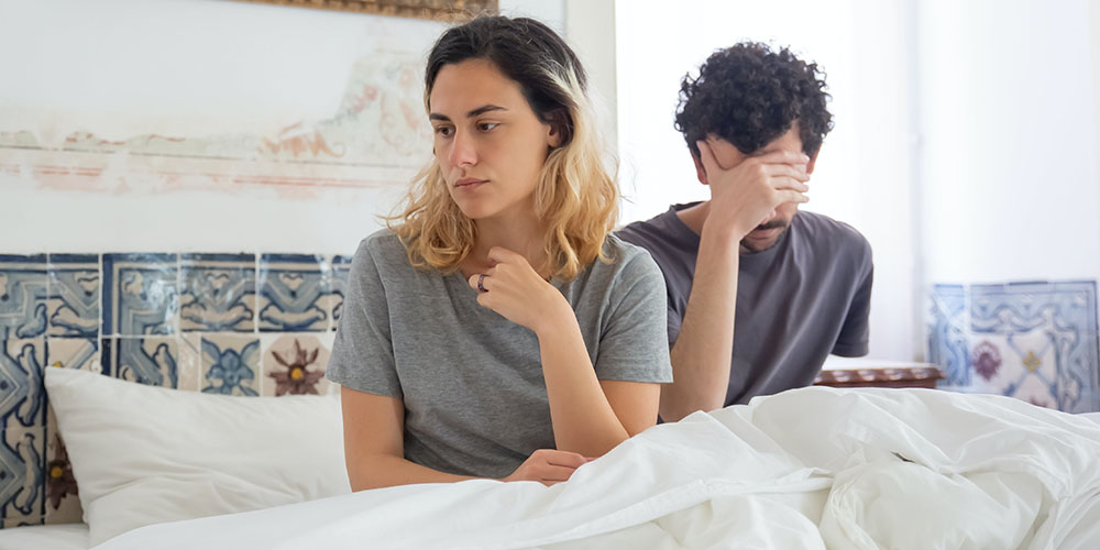 couple in bed experiencing sexual issue