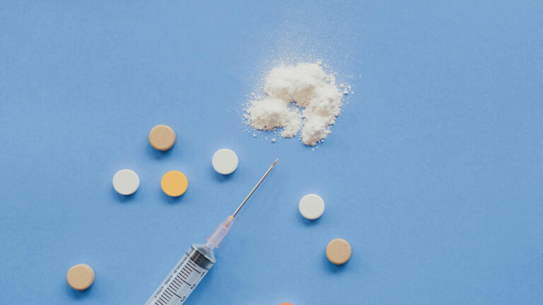 top view of syringe with pills