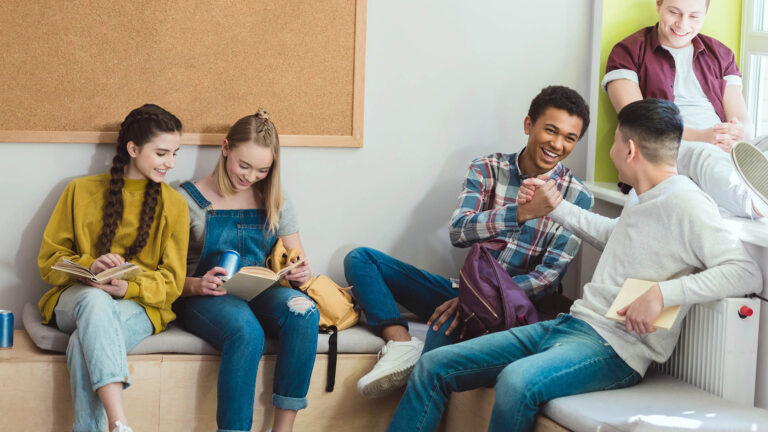 high school teenage students reading books