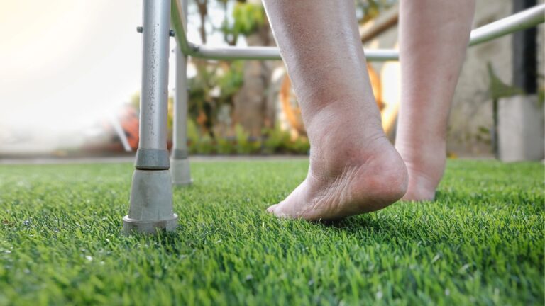 bare swollen feet on grass