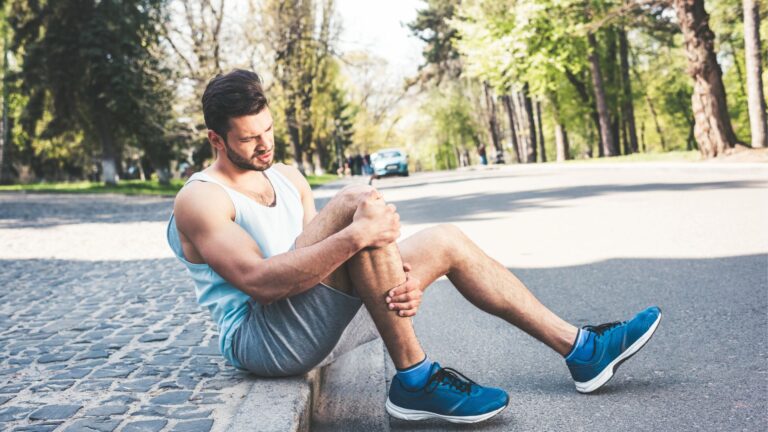 touching injured leg