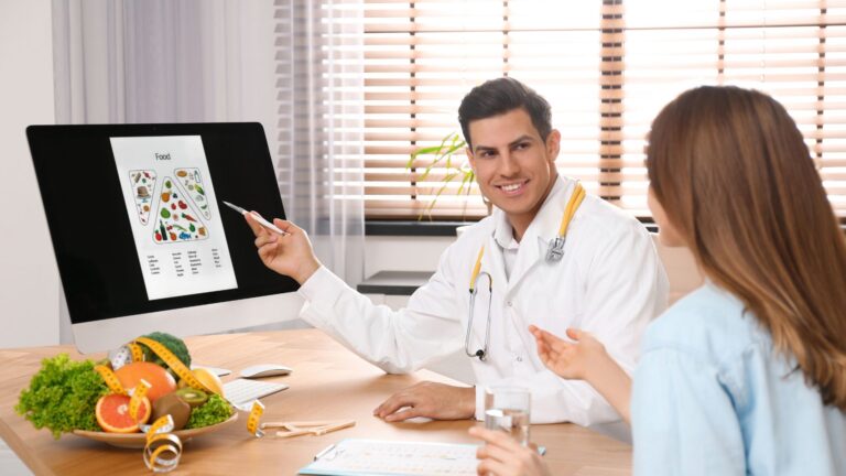 nutritionist consulting patient in clinic