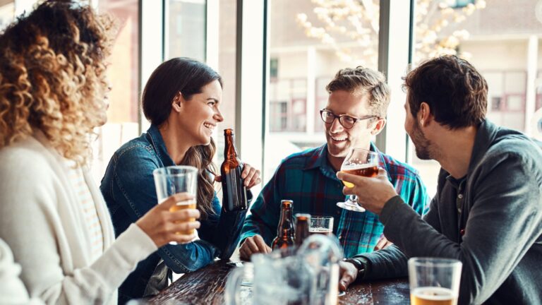 a group of friends enjoying themselves at a bar