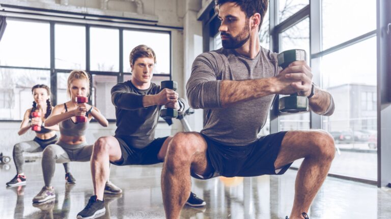 sporty people exercising in gym