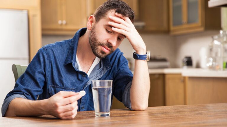 Guy with a beard feeling unwell