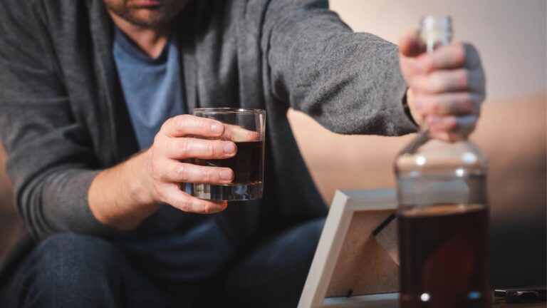 drunk man and glass bottle whiskey