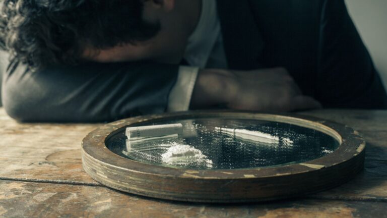 Businessman feeling ill after doing cocaine