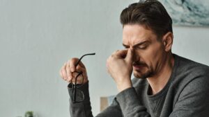 Stressed bearded man in casual wear