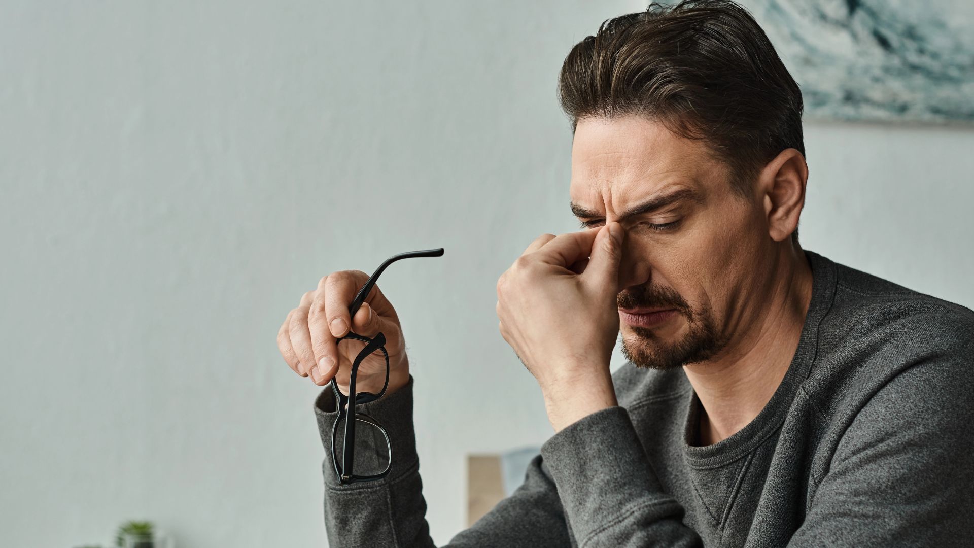 Stressed bearded man in casual wear