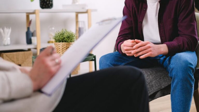 Therapist and client discussing issues in therapy session