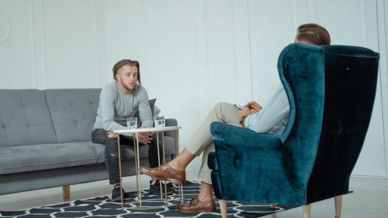 Two men engaged in a therapy session
