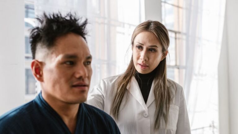 A medical practitioner attentively consulting a patient